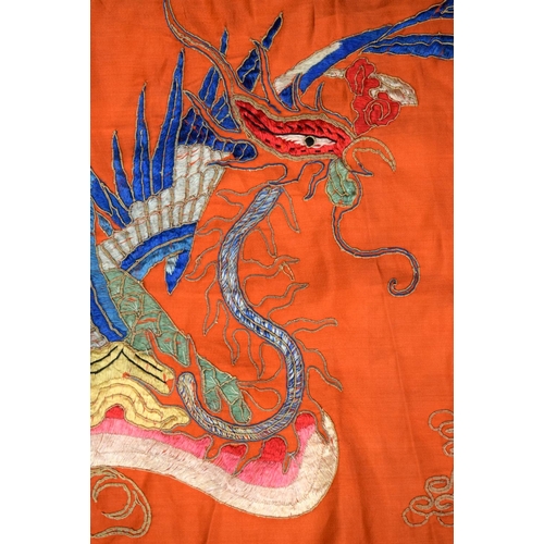 2054 - A PAIR OF 19TH CENTURY CHINESE ORANGE SILK EMBROIDERED DRAGON PANELS together with other similar sil... 