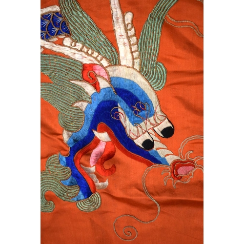 2054 - A PAIR OF 19TH CENTURY CHINESE ORANGE SILK EMBROIDERED DRAGON PANELS together with other similar sil... 