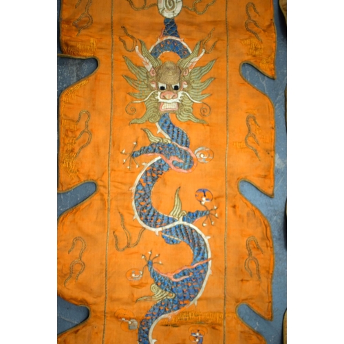 2054 - A PAIR OF 19TH CENTURY CHINESE ORANGE SILK EMBROIDERED DRAGON PANELS together with other similar sil... 