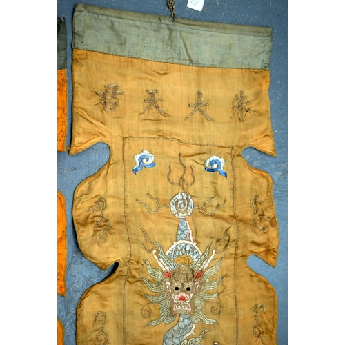 2054 - A PAIR OF 19TH CENTURY CHINESE ORANGE SILK EMBROIDERED DRAGON PANELS together with other similar sil... 