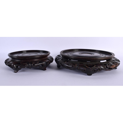 2057 - TWO 19TH CENTURY CHINESE CARVED HARDWOOD STANDS Qing, possibly Zitan. Largest 22 cm wide. (2)