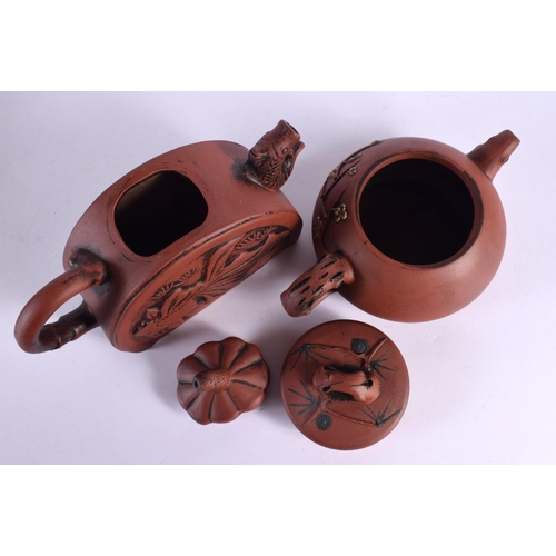 2071 - FIVE CHINESE YIXING POTTERY TEAPOT AND COVERS. Largest 15 cm wide. (5)