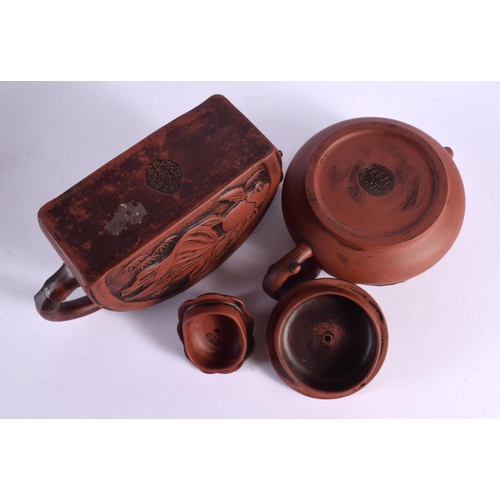 2071 - FIVE CHINESE YIXING POTTERY TEAPOT AND COVERS. Largest 15 cm wide. (5)