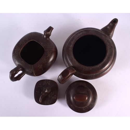 2073 - FIVE CHINESE YIXING POTTERY TEAPOT AND COVERS. Largest 15 cm wide. (5)