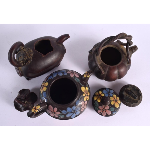 2073 - FIVE CHINESE YIXING POTTERY TEAPOT AND COVERS. Largest 15 cm wide. (5)