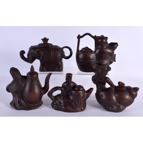 2074 - FIVE CHINESE YIXING POTTERY TEAPOT AND COVERS. Largest 15 cm wide. (5)