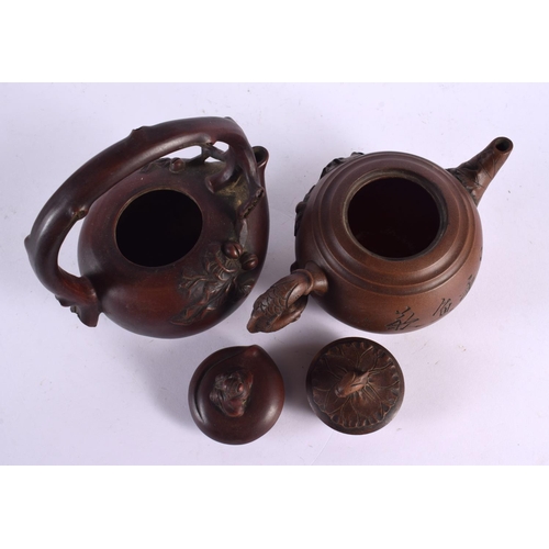 2076 - FIVE CHINESE YIXING POTTERY TEAPOT AND COVERS. Largest 15 cm wide. (5)