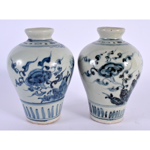 2084 - A PAIR OF 19TH CENTURY KOREAN BLUE AND WHITE PORCELAIN VASES painted with flowers. 13 cm high.