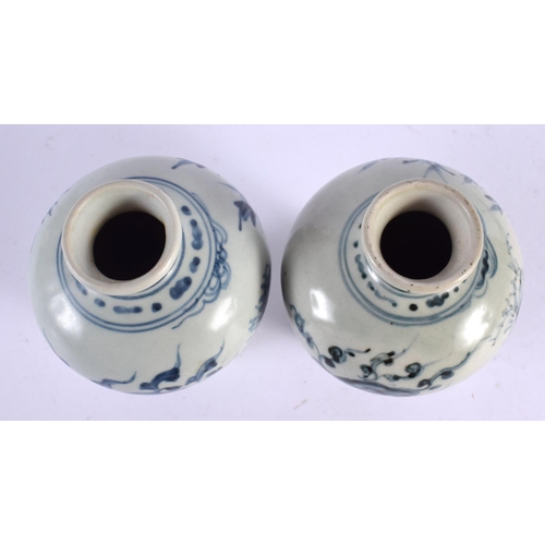 2084 - A PAIR OF 19TH CENTURY KOREAN BLUE AND WHITE PORCELAIN VASES painted with flowers. 13 cm high.