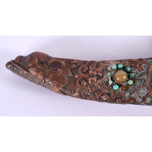 2090 - AN EARLY 20TH CENTURY CHINESE TIBETAN JEWELLED COPPER DAGGER decorated with foliage. 32 cm long.