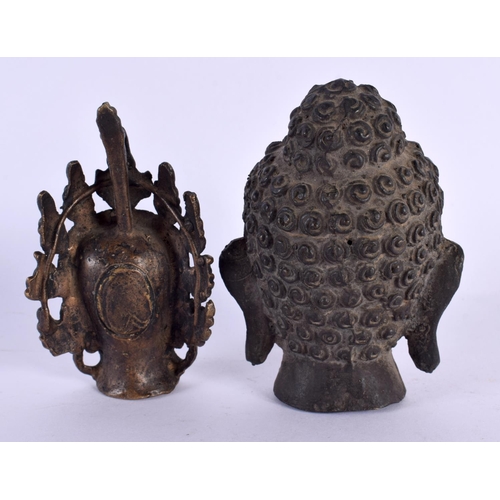 2097 - A 19TH CENTURY CHINESE TIBETAN BRONZE BUDDHA HEAD together with a similar bronze head. Largest 10 cm... 