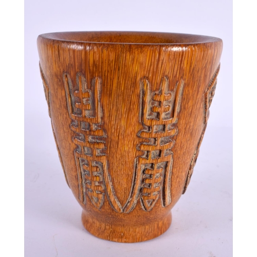 2102 - A CHINESE CARVED BUFFALO HORN TYPE LIBATION CUP 20th Century. 433 grams. 10 cm x 8 cm.