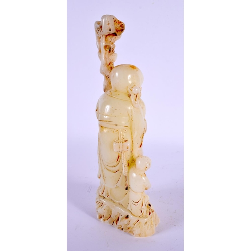 2106 - A CHINESE CARVED WHITE JADE TYPE FIGURE OF SAGE 20th Century. 19 cm high.