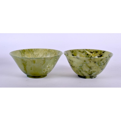 2119 - TWO EARLY 20TH CENTURY CHINESE CARVED JADEITE BOWLS Late Qing/Republic. Largest 9.5 cm diameter. (2)