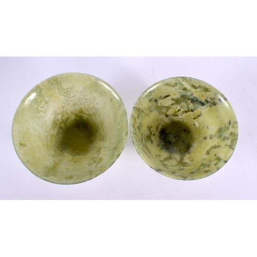 2119 - TWO EARLY 20TH CENTURY CHINESE CARVED JADEITE BOWLS Late Qing/Republic. Largest 9.5 cm diameter. (2)