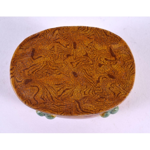 2137 - A SMALL CHINESE YELLOW GLAZED TANG STYLE SCHOLARS OBJECT 20th Century. 8 cm x 5.5 cm.