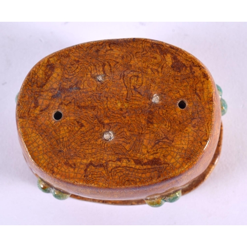 2137 - A SMALL CHINESE YELLOW GLAZED TANG STYLE SCHOLARS OBJECT 20th Century. 8 cm x 5.5 cm.