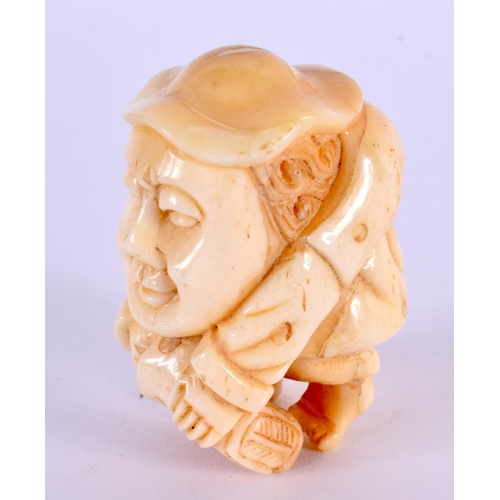 2156 - A JAPANESE CARVED BONE MAN NETSUKE. 5 cm x 3.5 cm.