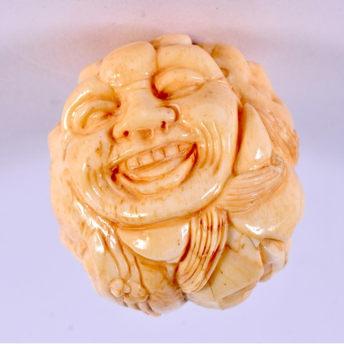 2157 - A JAPANESE CARVED BONE MASK HEAD NETSUKE. 4.5 cm x 3.5 cm.