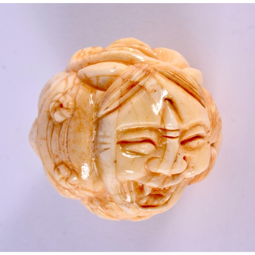 2157 - A JAPANESE CARVED BONE MASK HEAD NETSUKE. 4.5 cm x 3.5 cm.