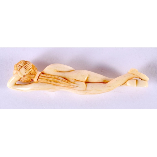 2161 - A JAPANESE CARVED BONE MEDICINE DOLL. 8 cm long.