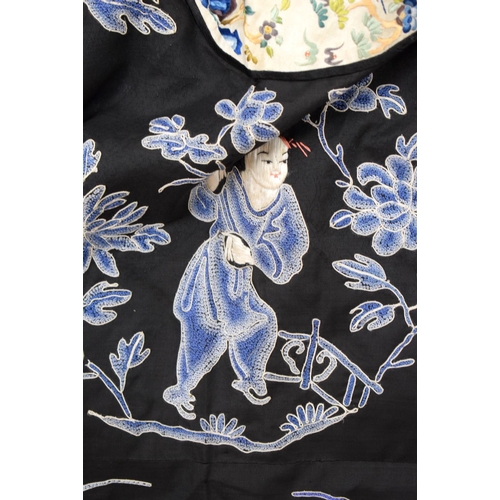 2213 - AN UNUSUAL LATE 19TH CENTURY CHINESE MIDNIGHT BLUE SILK EMBROIDERED ROBE Qing, decorated with figure... 