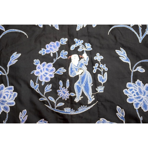 2213 - AN UNUSUAL LATE 19TH CENTURY CHINESE MIDNIGHT BLUE SILK EMBROIDERED ROBE Qing, decorated with figure... 