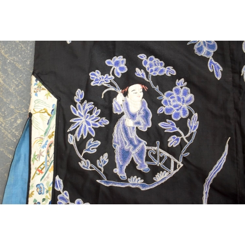 2213 - AN UNUSUAL LATE 19TH CENTURY CHINESE MIDNIGHT BLUE SILK EMBROIDERED ROBE Qing, decorated with figure... 