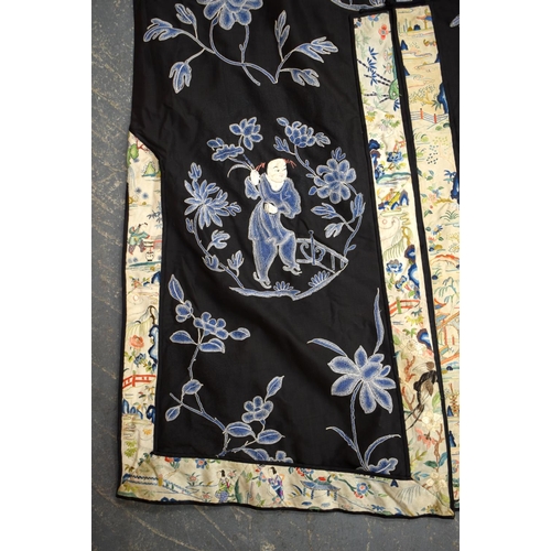 2213 - AN UNUSUAL LATE 19TH CENTURY CHINESE MIDNIGHT BLUE SILK EMBROIDERED ROBE Qing, decorated with figure... 