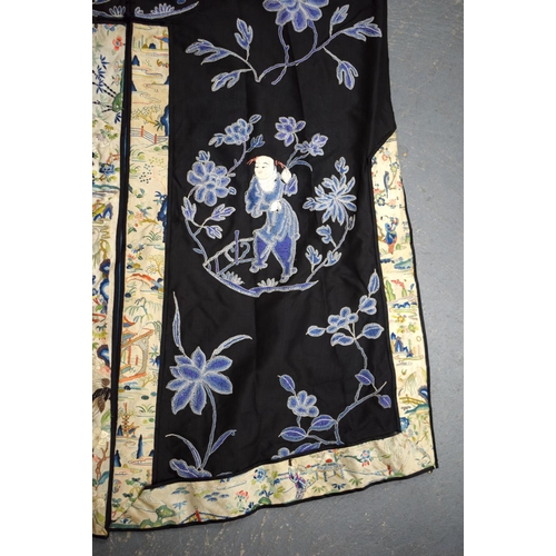 2213 - AN UNUSUAL LATE 19TH CENTURY CHINESE MIDNIGHT BLUE SILK EMBROIDERED ROBE Qing, decorated with figure... 