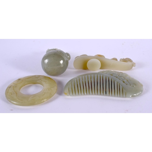 2226 - A CHINESE CARVED JADE BELT HOOK 20th Century, together with a jade comb, fruiting pod & circular bi ... 