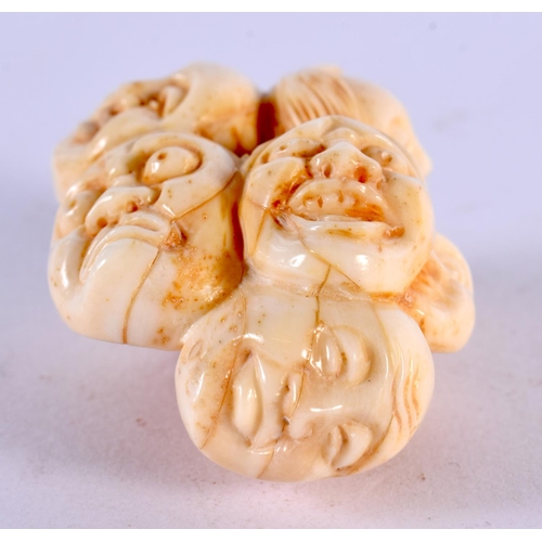 2228 - A JAPANESE CARVED BONE MASK NETSUKE. 5 cm x 3 cm.