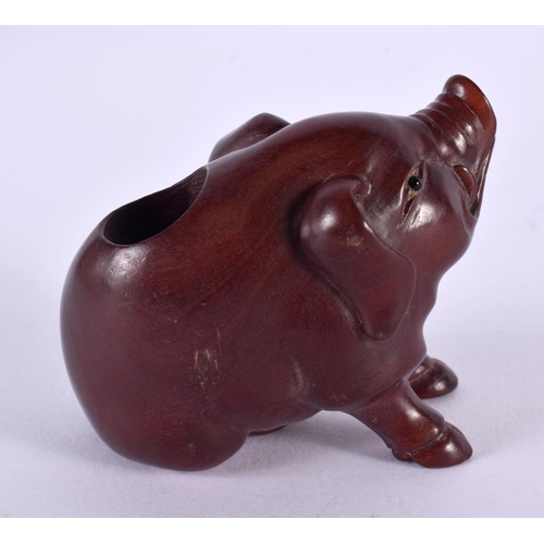 2232 - A JAPANESE CARVED BOXWOOD PIG OKIMONO. 7 cm x 5 cm.