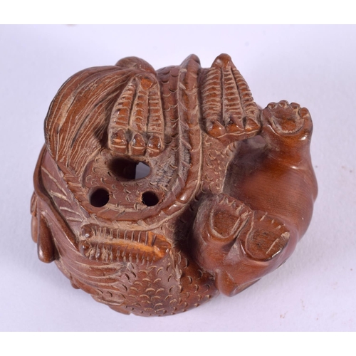 2238 - A JAPANESE CARVED BOXWOOD DRAGON NETSUKE. 8 cm x 6 cm.