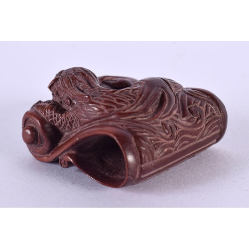 2245 - A JAPANESE CARVED BOXWOOD DRAGON NETSUKE. 4 cm x 3 cm.