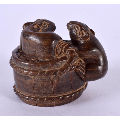 2246 - A JAPANESE CARVED BOXWOOD TOAD AND BASKET NETSUKE. 5 cm x 3 cm.