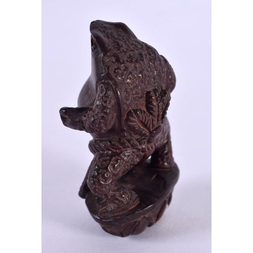 2247 - A JAPANESE CARVED BOXWOOD STANDING TOAD NETSUKE. 6 cm x 3 cm.