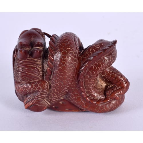 2252 - A JAPANESE CARVED BOXWOOD DRAGON NETSUKE. 5 cm x 3 cm.