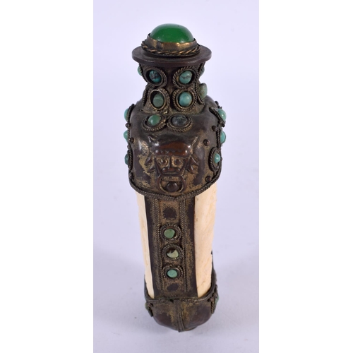 2263 - A 19TH CENTURY CHINESE TIBETAN WHITE METAL AND BONE SNUFF BOTTLE carved with figures. 9.5 cm x 5 cm.