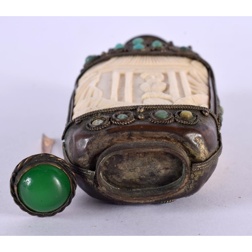 2263 - A 19TH CENTURY CHINESE TIBETAN WHITE METAL AND BONE SNUFF BOTTLE carved with figures. 9.5 cm x 5 cm.