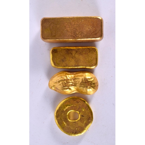 2282 - FOUR CHINESE YELLOW METAL SCROLL WEIGHT INGOTS. 417 grams. Largest 6.5 cm x 3 cm. (4)