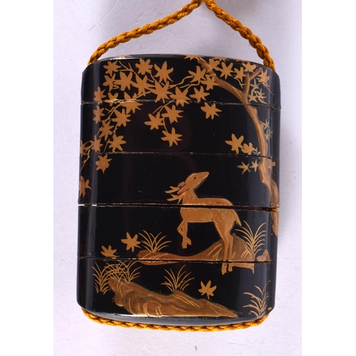 2288 - A 19TH CENTURY JAPANESE MEIJI PERIOD BLACK LACQUER INRO decorated in gold lacquer with deer in lands... 