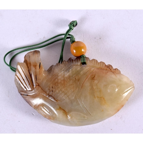 2299 - A 19TH CENTURY CHINESE CARVED GREEN JADE FISH PENDANT Qing. 7 cm x 4 cm.