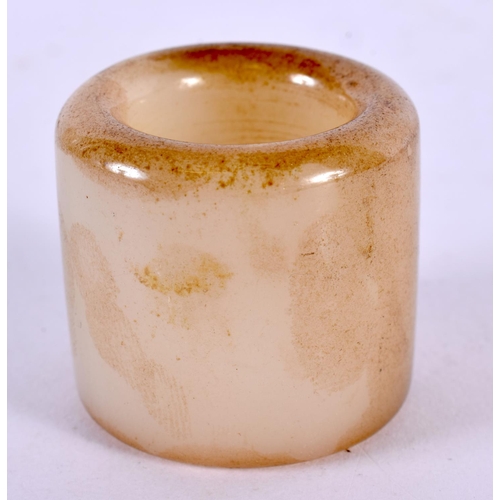 2302 - A CHINESE CARVED JADE ARCHERS RING 20th Century. 4 cm wide.