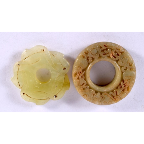 2303 - TWO CHINESE CARVED JADE ROUNDELS 20th Century. Largest 5 cm wide. (2)