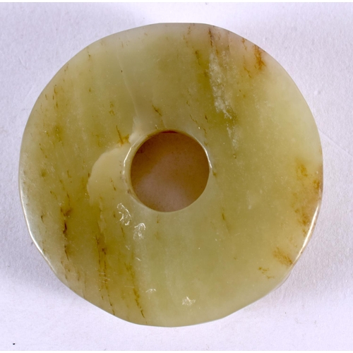 2304 - AN EARLY 20TH CENTURY CHINESE CARVED TRI BAT JADE ROUNDEL Late Qing/Republic. 5.5 cm wide.