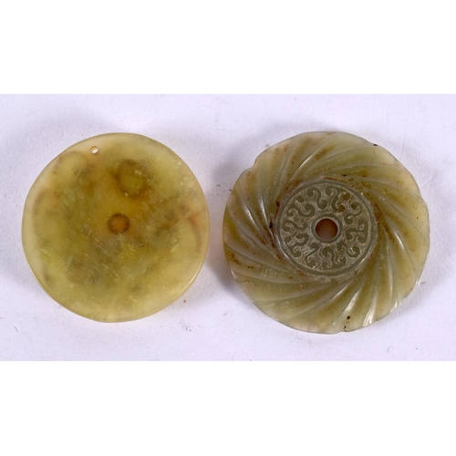 2305 - TWO CHINESE CARVED JADE ROUNDELS 20th Century. 5 cm wide. (2)