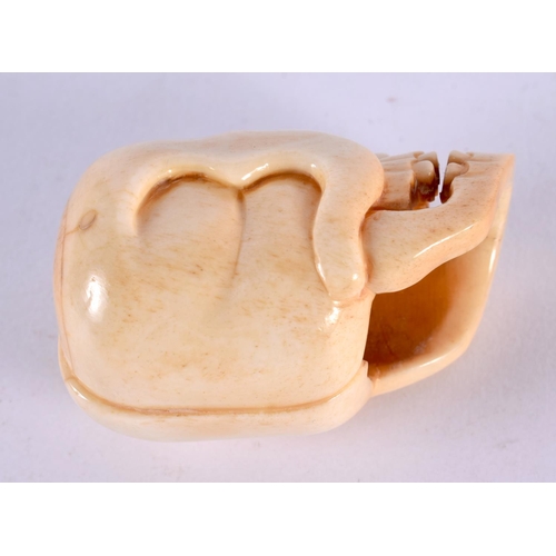 2317 - A JAPANESE CARVED BONE ANATOMICAL SKULL MASK. 5 cm x 3 cm.