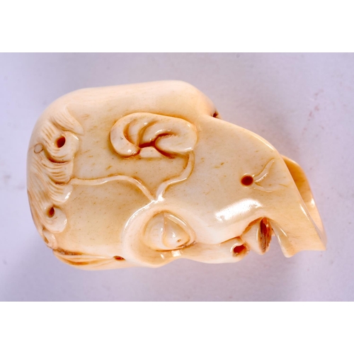 2317 - A JAPANESE CARVED BONE ANATOMICAL SKULL MASK. 5 cm x 3 cm.