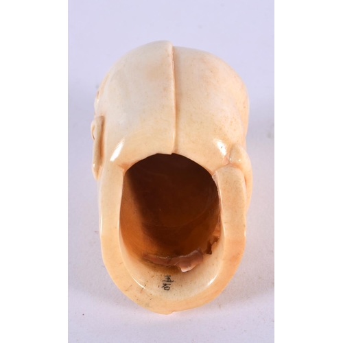 2317 - A JAPANESE CARVED BONE ANATOMICAL SKULL MASK. 5 cm x 3 cm.